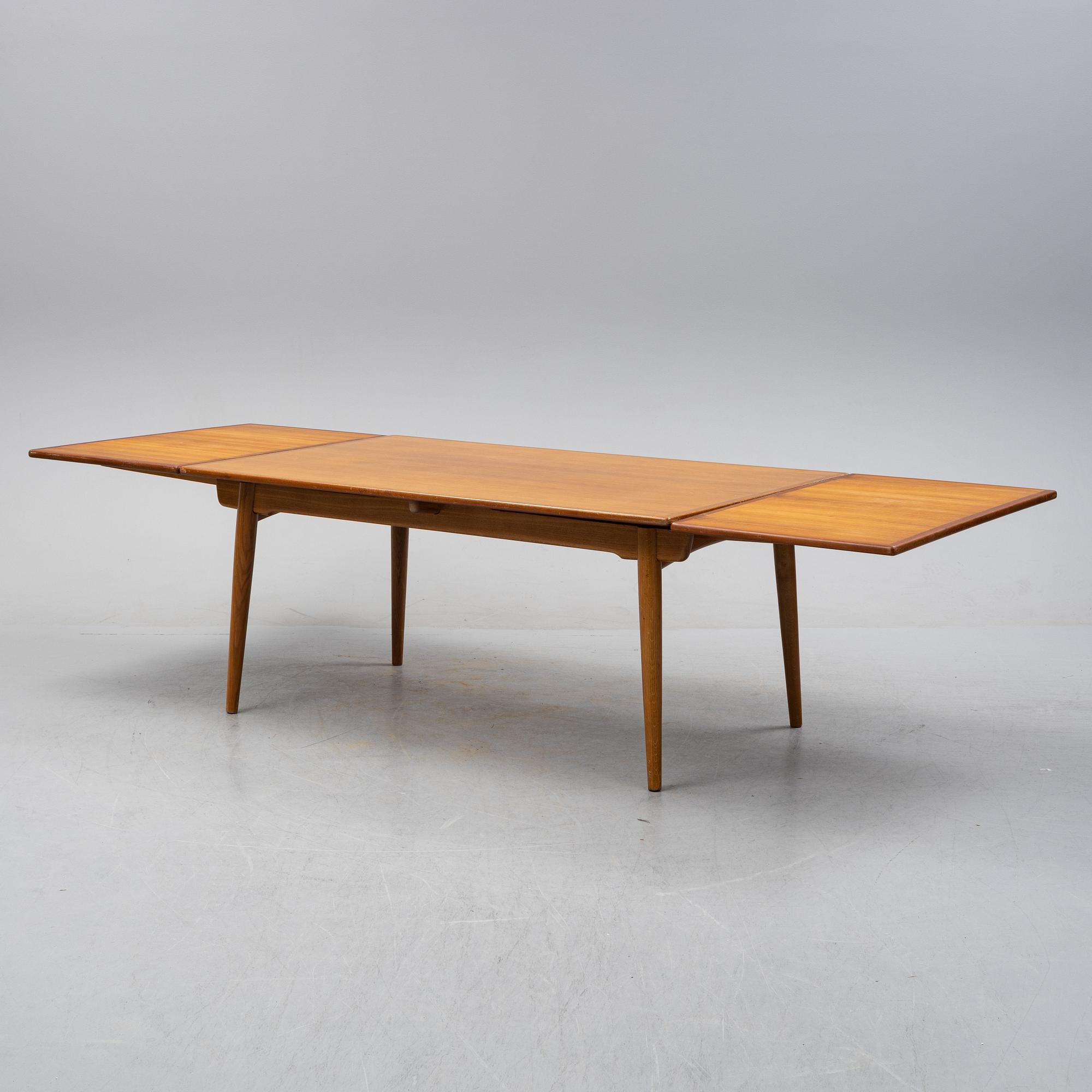 Hans J Wegner, a model 'AT-312' teak veneered dining table, Andreas Tuck, Denmark.
