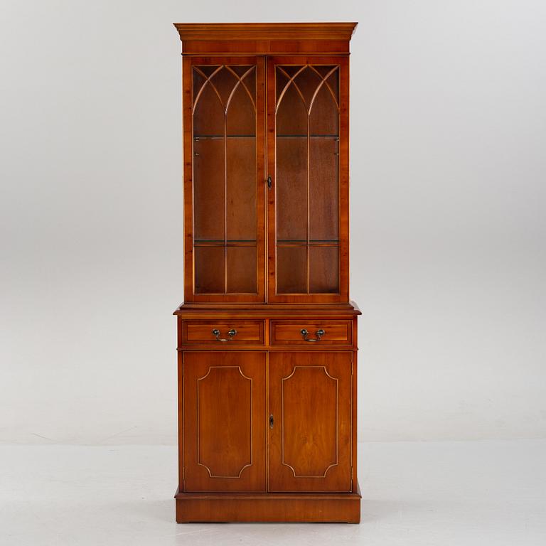 An English yew cabinet, 21st Century.