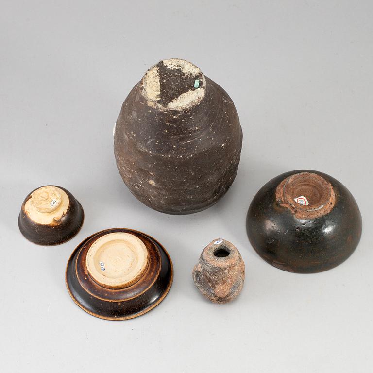 A group of five brown glazed South East Asian ceramics, 19/20th Century.