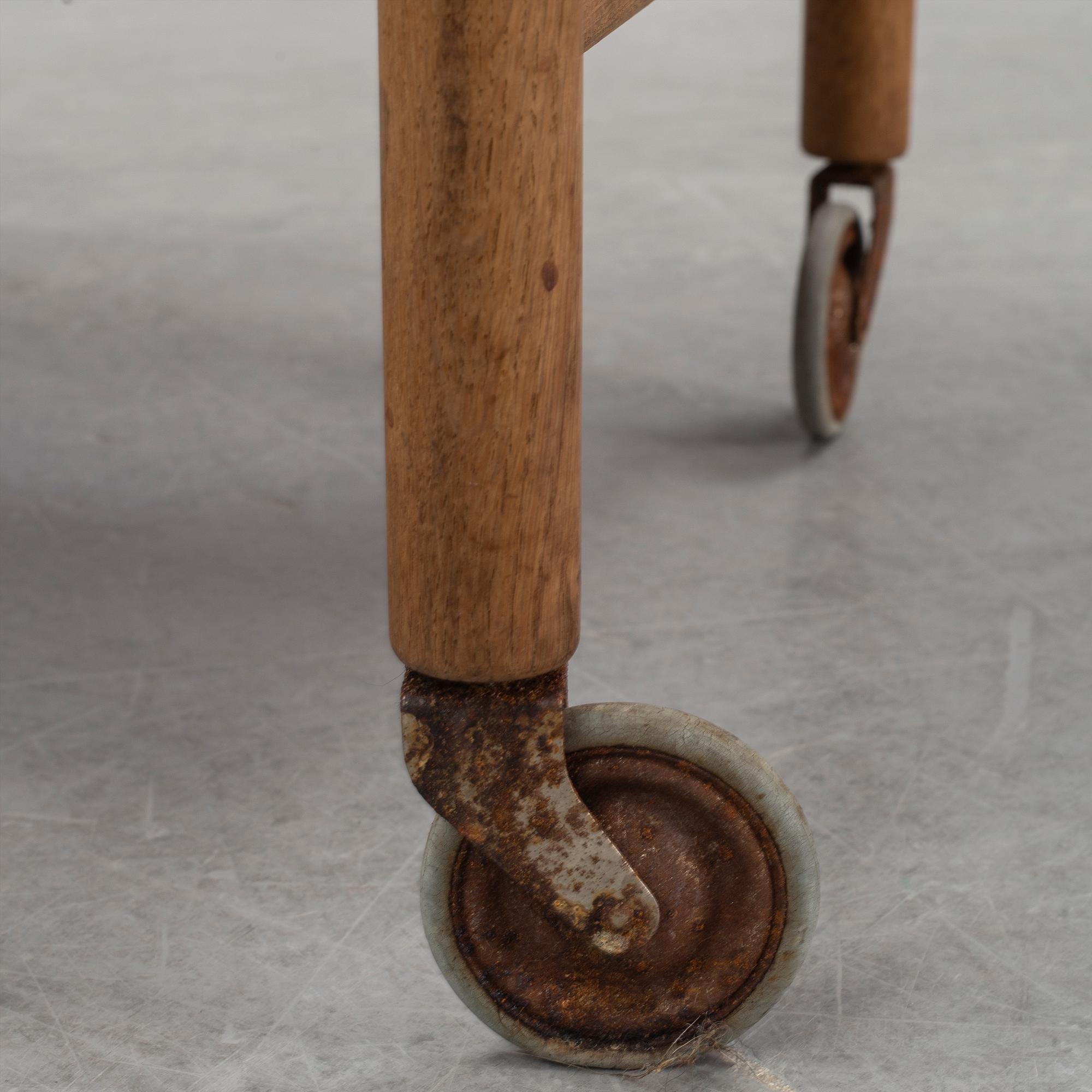 Hans J Wegner, a teak and oak serving trolley from Andreas Tuck, Denmark.