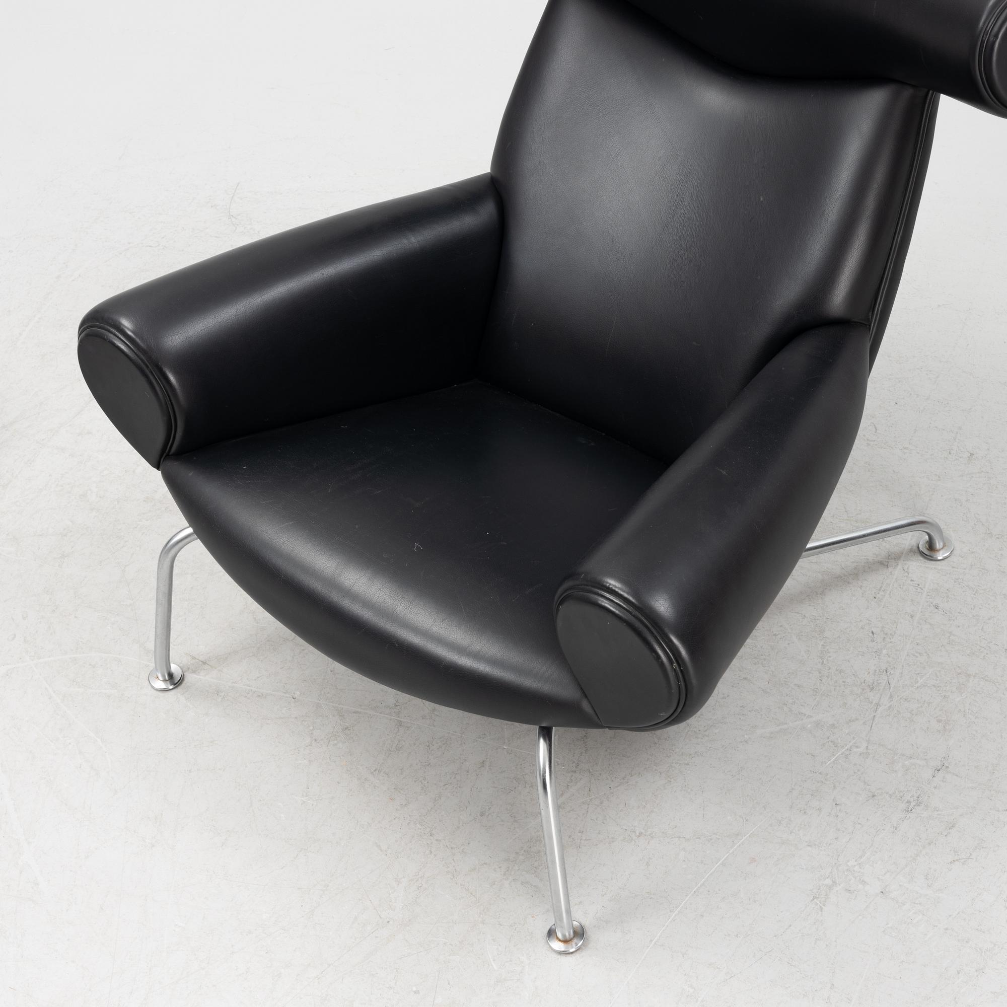 Hans J Wegner, an 'Ox Chair' and an ottoman, for Erik Jørgensen, Denmark, 2005 and 2010.