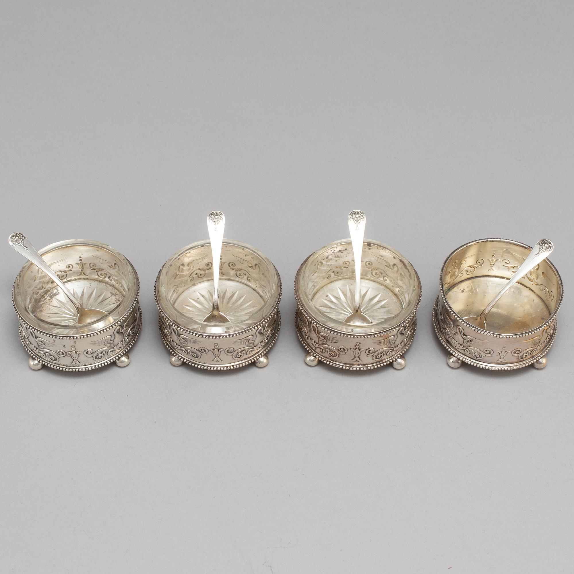 A set of four Fabergé salt-cellars and spoons, marked Moscow 1908-1917. Imperial Warrant.
