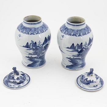 A pair of blue and white Chinese porcelain jars with covers. Qing dynasty, Qianlong (1736-95).