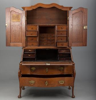 A TWO-PIECE WRITING CABINET.