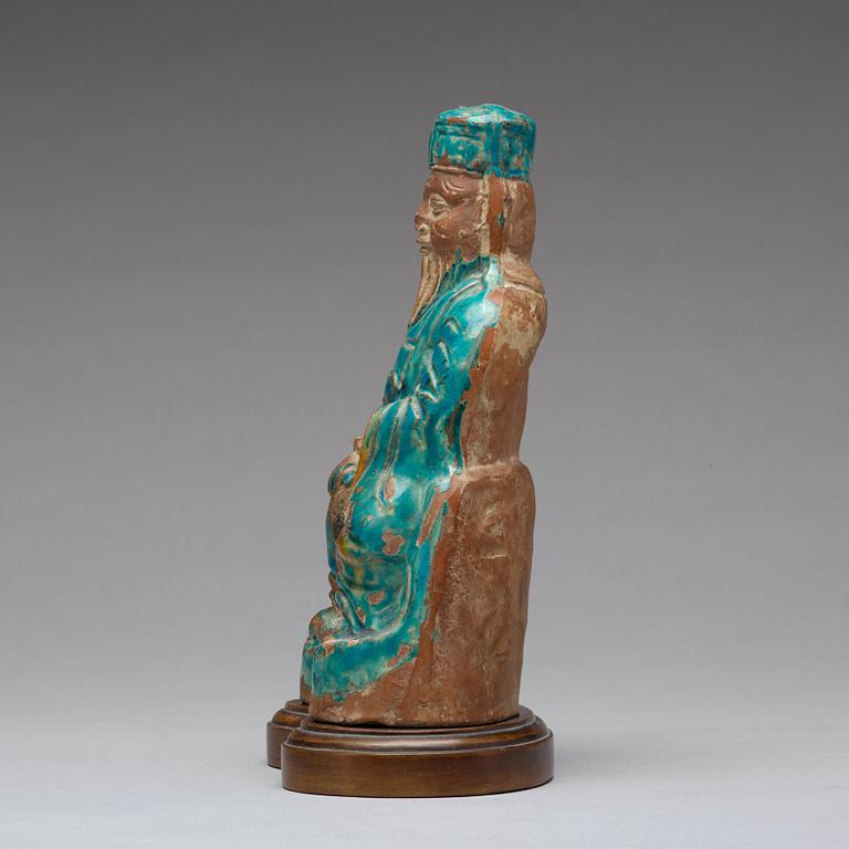 A turqoise glazed figure of a deity, Ming dynasty, 17th century.