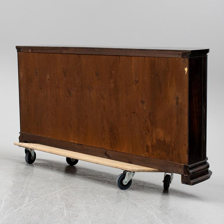 A 1930s stained birch shelf.