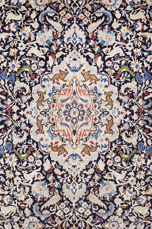 A Nain carpet, part silk, so-called 6 LAA, approx. 324 x 210 cm.