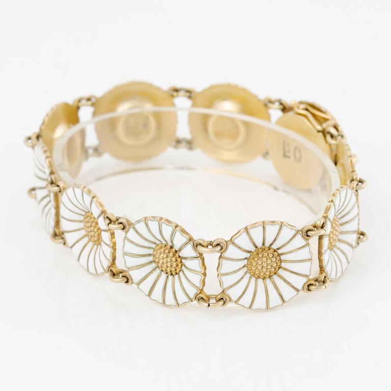 Georg Jensen and A Michelsen "Daisy" a bracelet, a pendant, and a brooch silver gilt and enamel.
