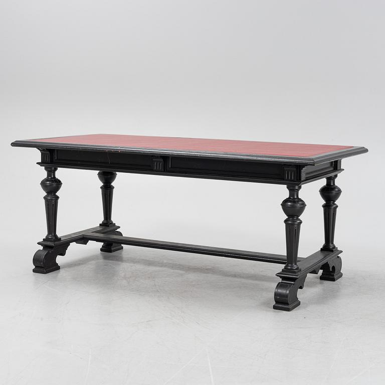 A renaissance style library table, around 1900.