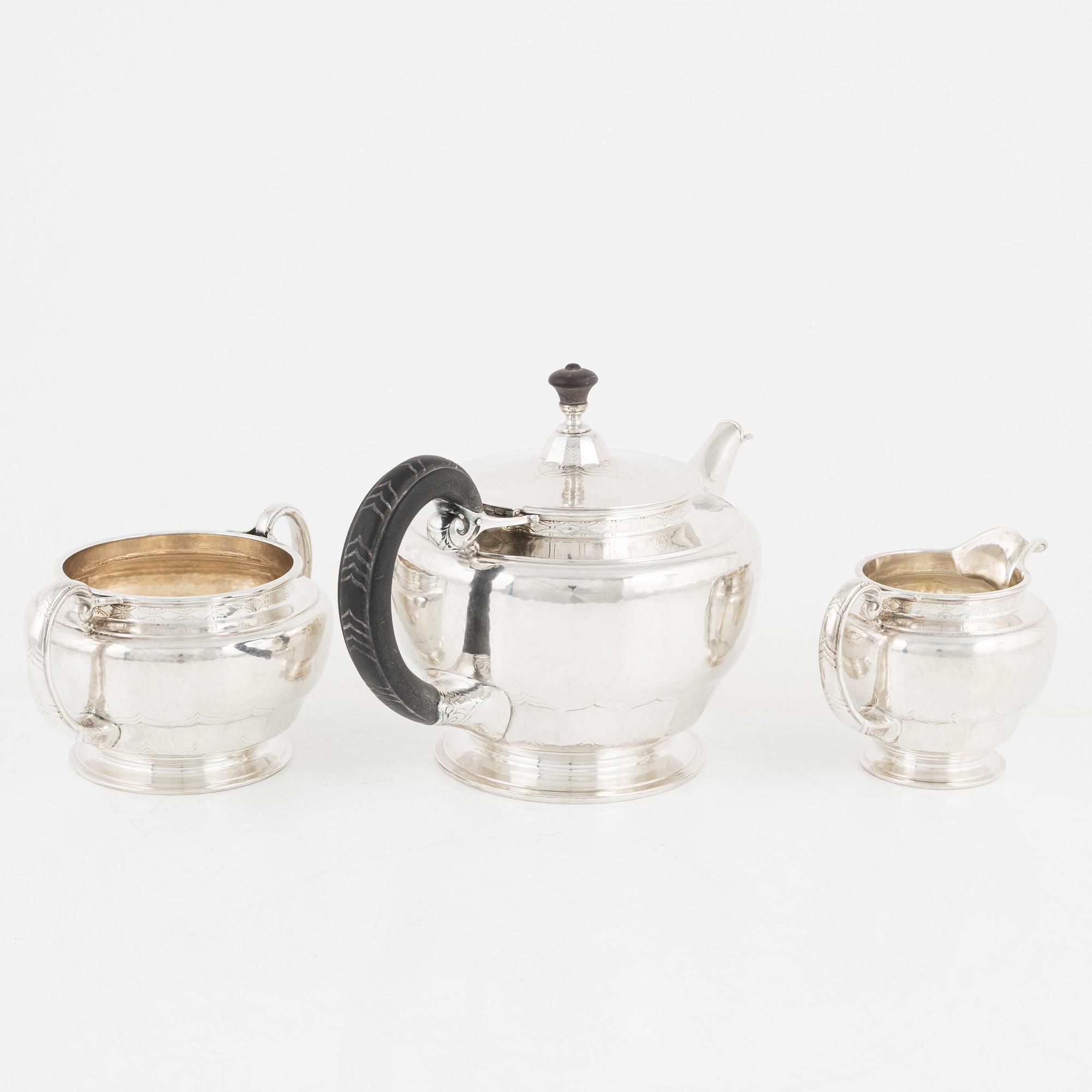 A Norwegian Silver Teapot, Sugar Bowl and Creamer, mark of David Andersen, Oslo circa 1923.