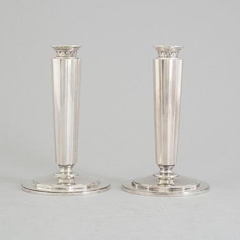 A pair of sterling silver candle sticks by Atelier Borgila. Stockholm 1956.