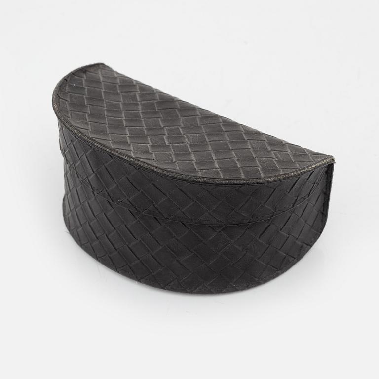 Bottega Veneta, a pair of sunglasses.