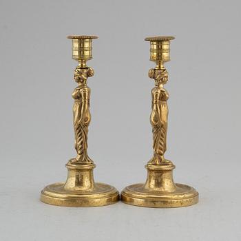 A pair of late Gustavian bronze candlesticks, early 19th century.