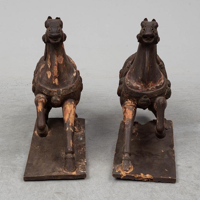 Two large wooden sculptures of horses, 20th century.
