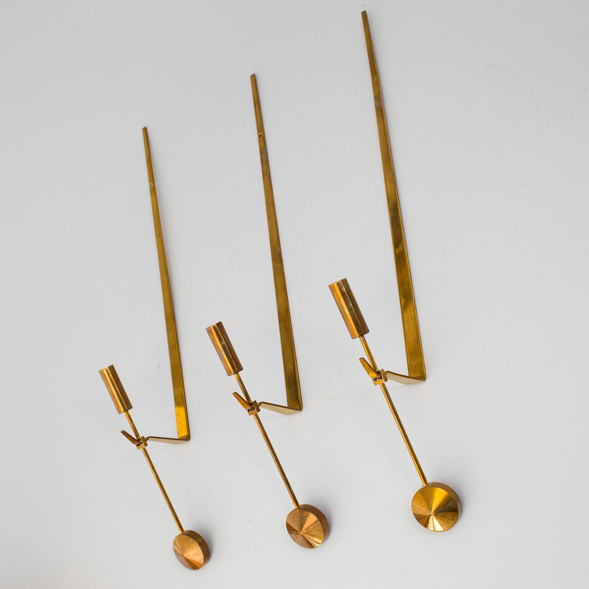 PIERRE FORSSELL,  three 'Pendeln' brass wall sconces from Skultuna.