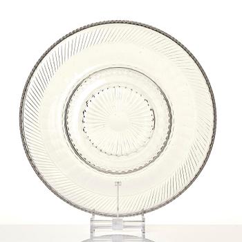 A cut glass punch bowl with cover, stand and ladle, Empire, first part of the 19th century.