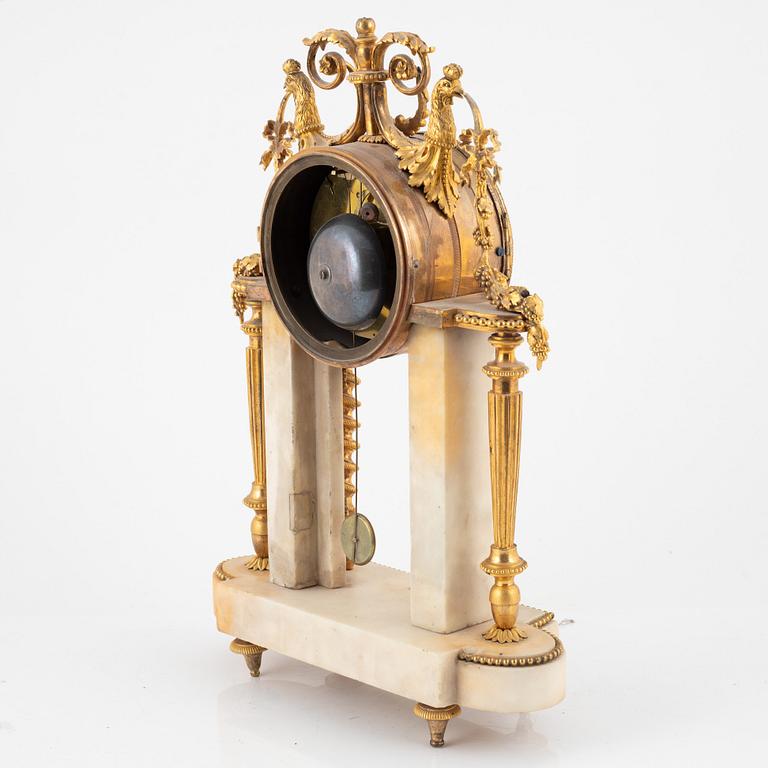 A Louis XVI marble and ormolu portico clock, the dial signed Bouchet, late 18th century.