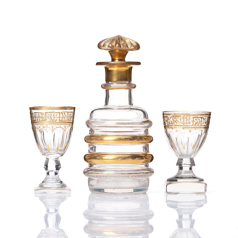 A set of Russian glasses (13 pcs.) and a bottle with stopper, 19th Century.