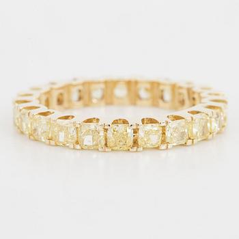 Yellow cushion shaped diamond ring.