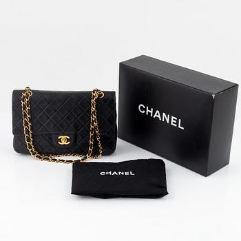 Chanel, A black leather 'Double Flap Bag', 1989 - 1991.