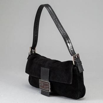 FENDI, a black suede handbag.