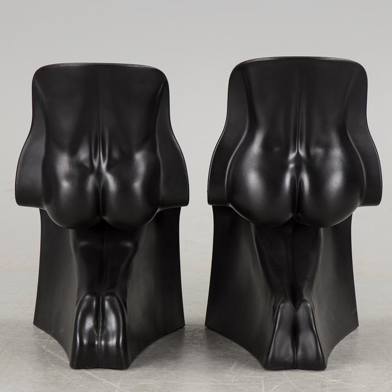 a pair of Italian black plastic chairs designed by Fabio Novembre "Him" and "Her" from the late 20th Century.