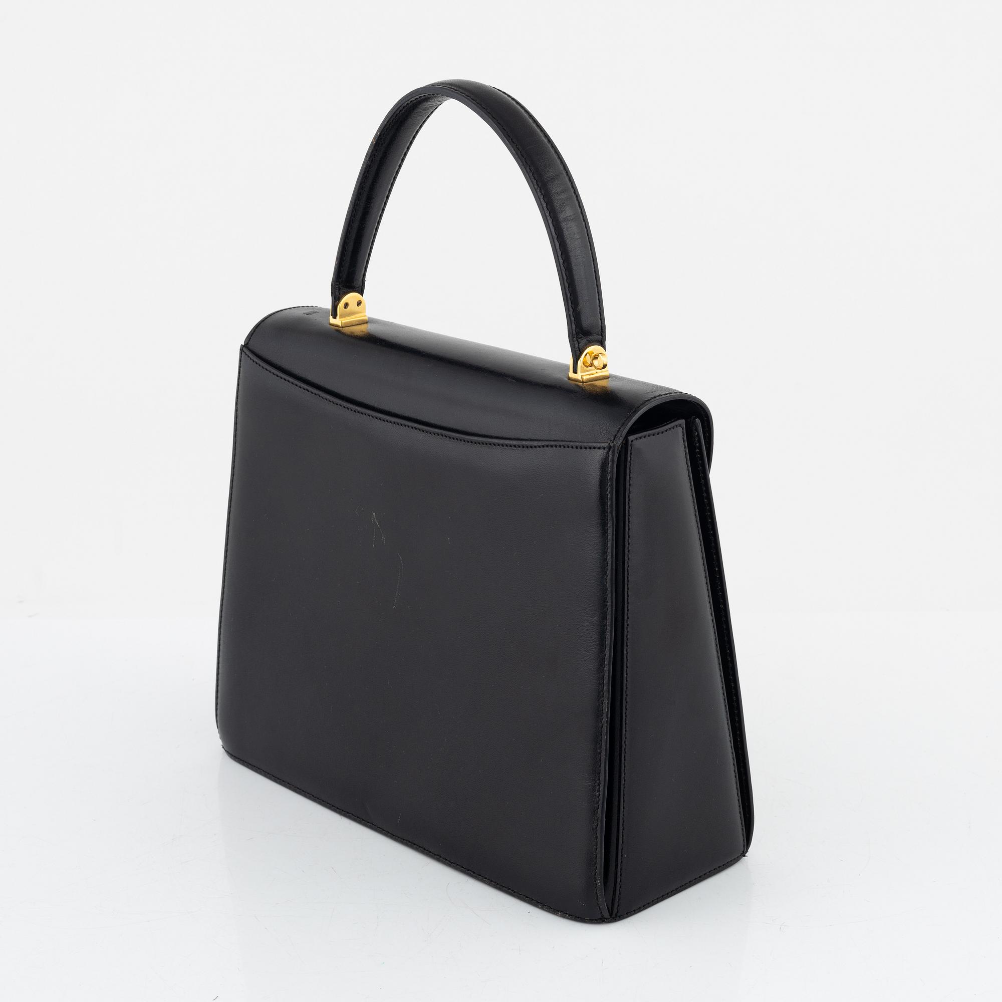 Bally, a black leather bag.