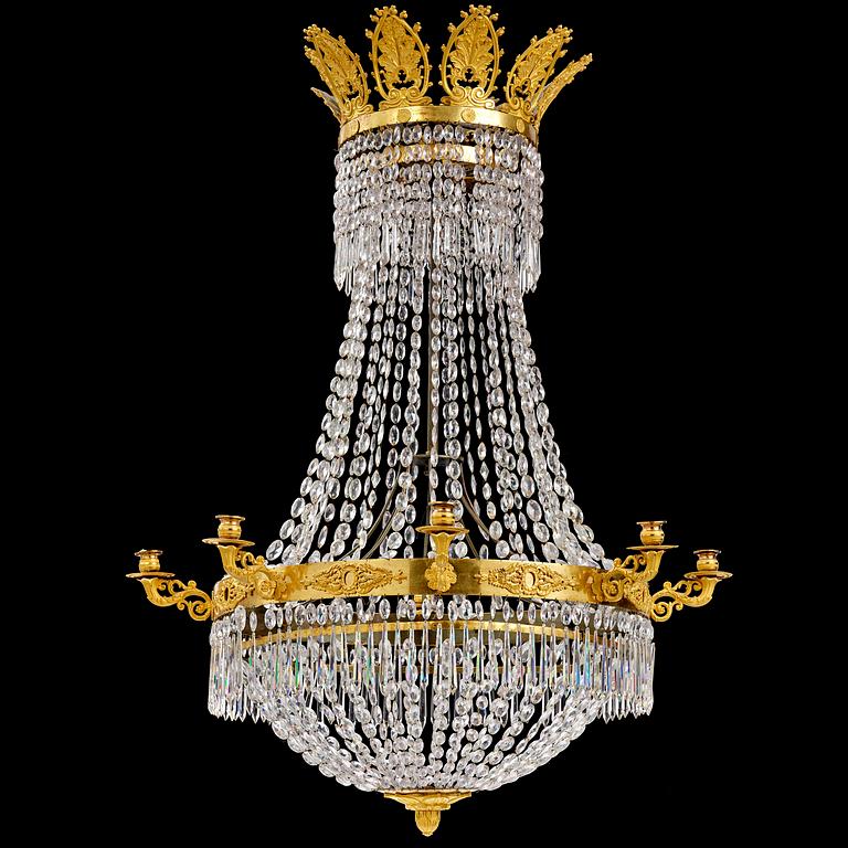 An French Empire eight-light gilt-brass and cut-glass chandelier.