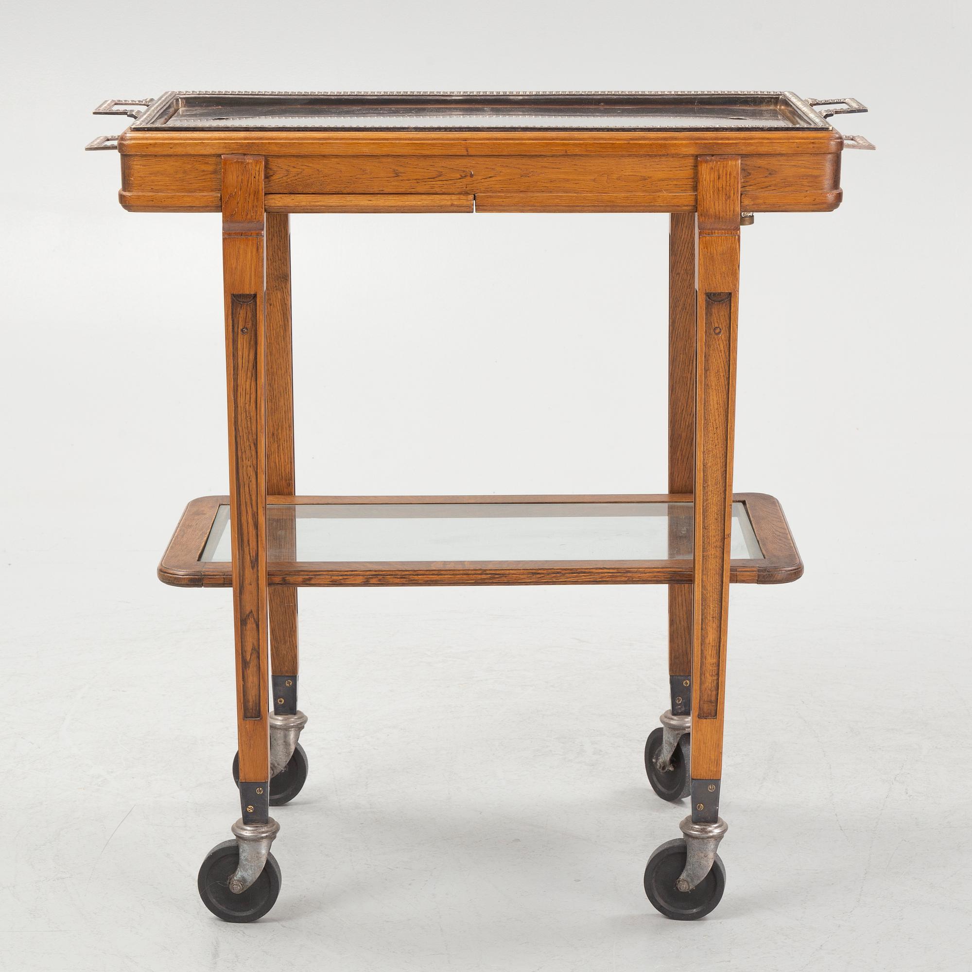 A restaurant serving trolley with silver plate dishes, first half of the/mid 20th century.