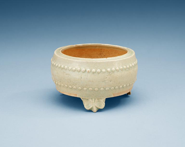 A pale celadon glazed tripod censer, Yuan dynasty (1280-1367).