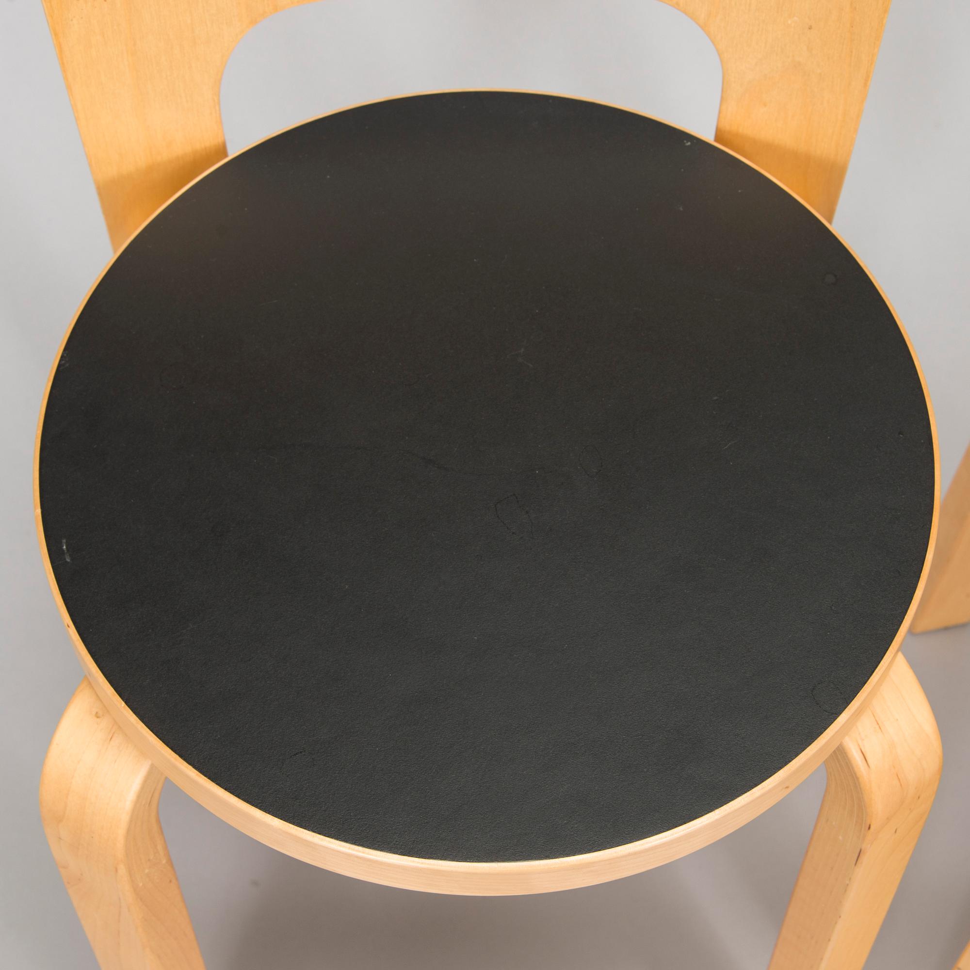 Alvar Aalto, a table and three chairs, Artek 2006 and 2007.