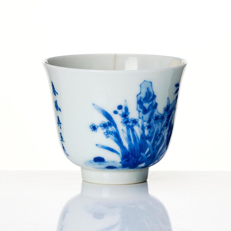 A blue and white month cup 'Narcissus', late Qing dynasty with Kangxi mark.