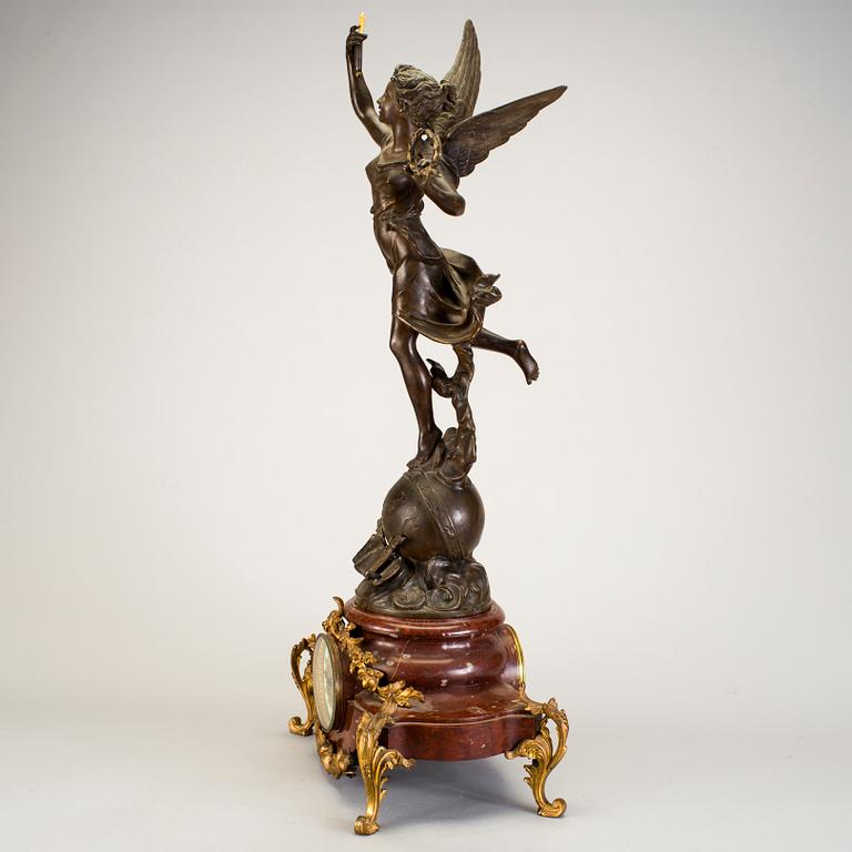 A mantel clock with sculpture "L'occident" after Émile Bruchon from the turn of the century 1800/1900.
