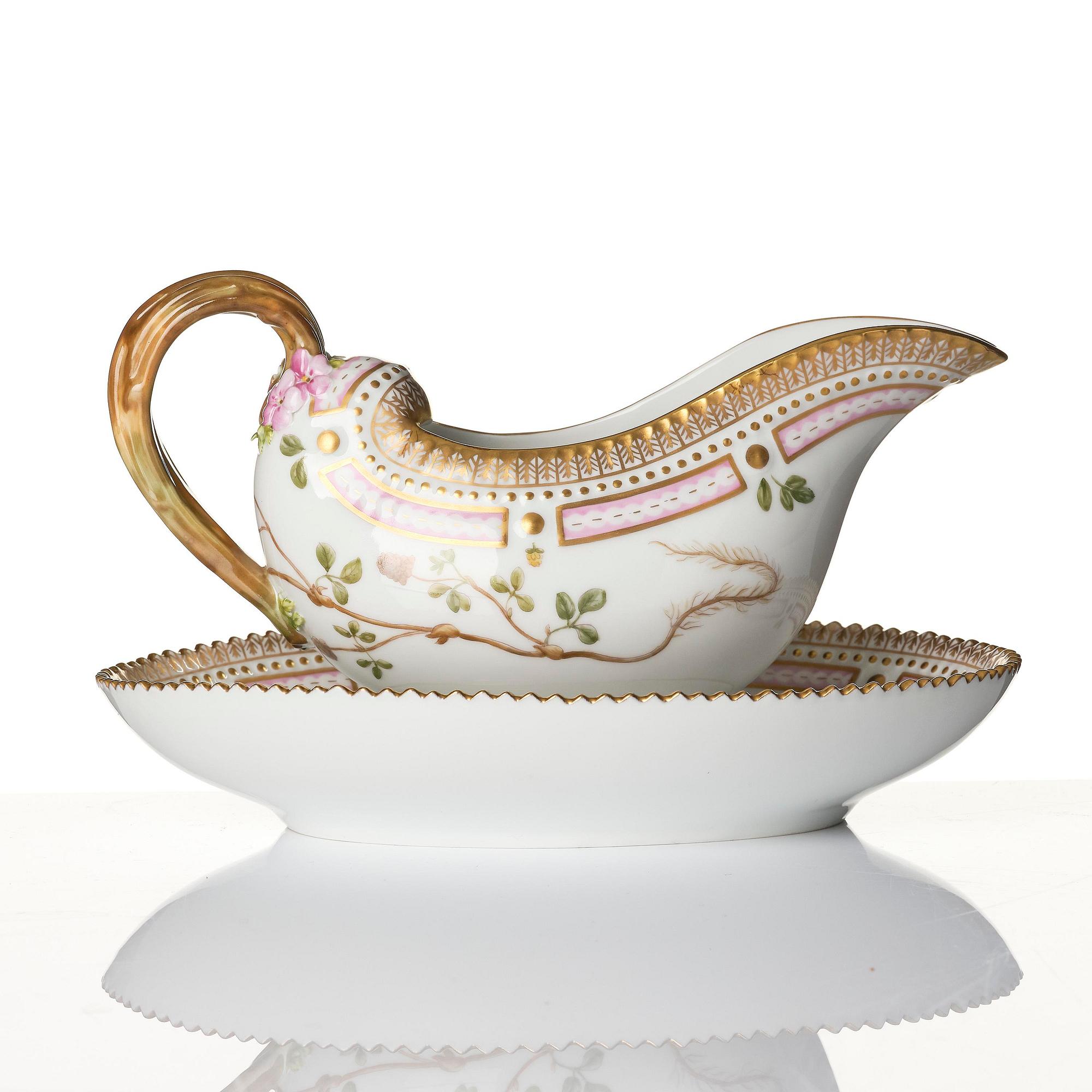 A Royal Copenhagen 'Flora Danica' sauce boat and a pillow shaped bowl, Denmark, 20th century.