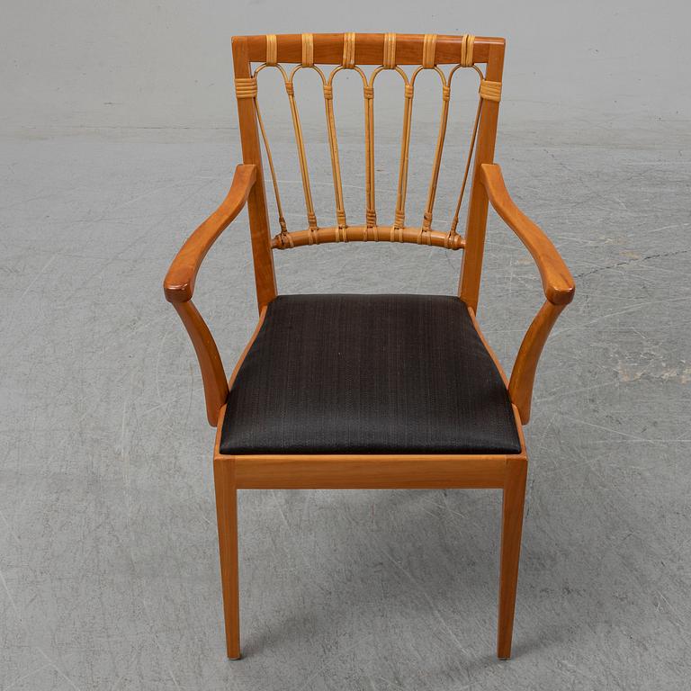 A pair of mahogany and rattan dining armchairs, Josef Frank, , model 1165, Svenskt Tenn, Stockholm.