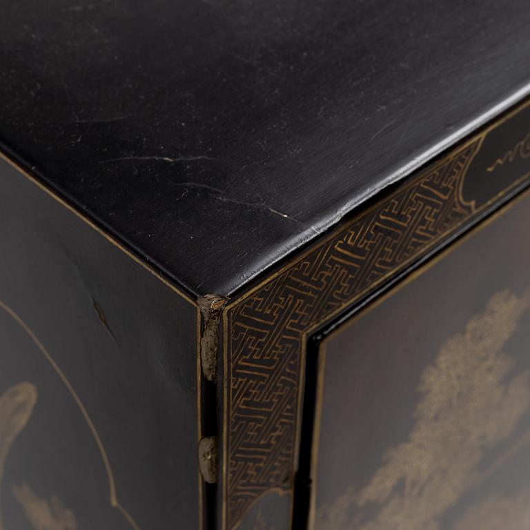 A Chinese lacquered two-part cabinet, first part of the 20th century.