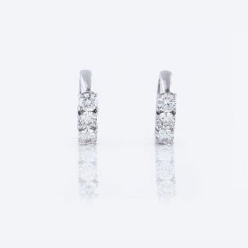 A pair of ca 1.00 cts brilliant-cut diamond earrings, from Milano, Italy.