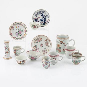 A Chinese porcelain set of cups, saucers and vase, Qing Dynasty, mostly Qianlong (1736-95) (13 pieces).