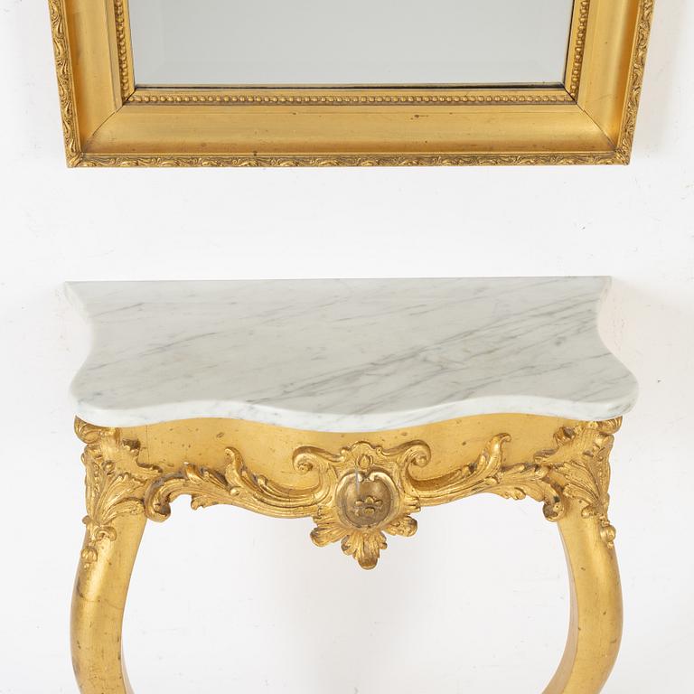 A rococo style mirror and console table, around 1900.