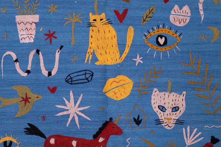 A hand-embroidered Kelim rug, 185 x 124 cm.