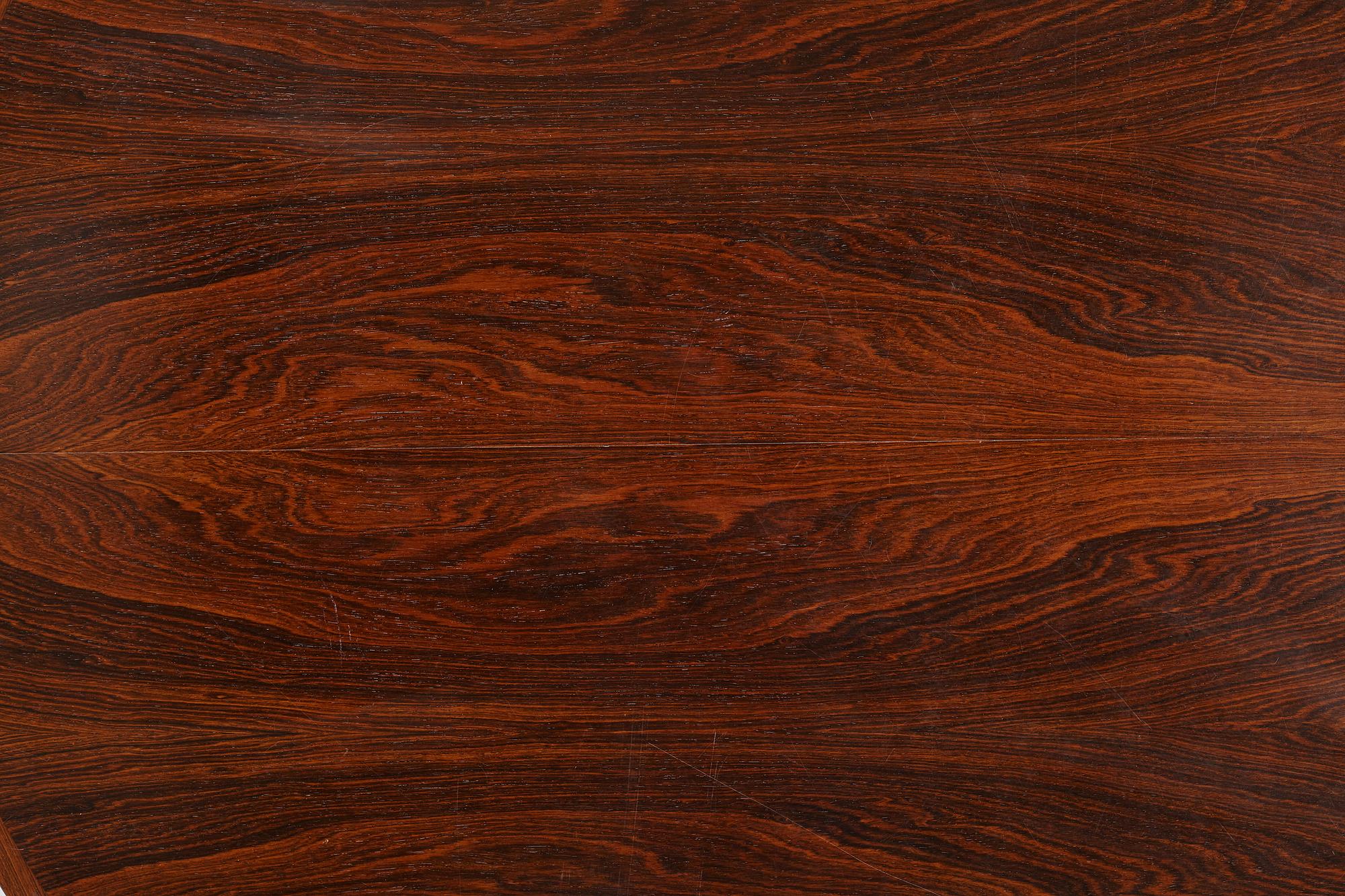 Niles Otto Møller, a rosewood veneered table with four chairs, JL Møller, Denmark, 1950's/60's.