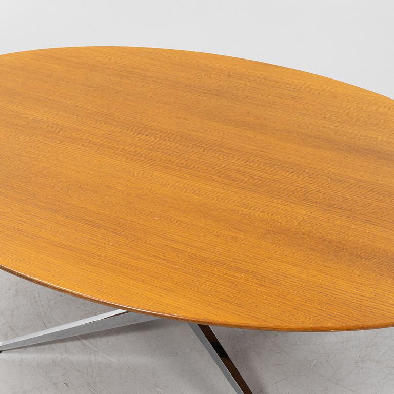 An 'Oval 96' table by Florence Knoll for Knoll International.
