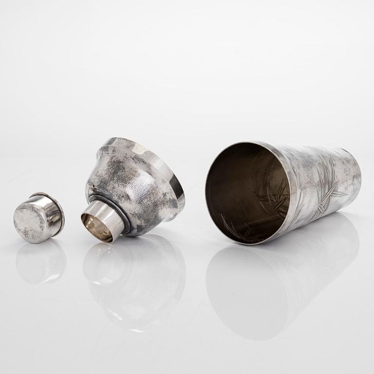 A silver cocktail shaker with strainer, Japan, first half of the 20th century.