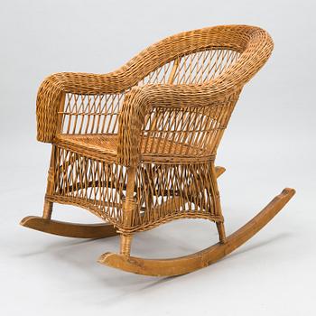 A mid-20th century rocking chair.