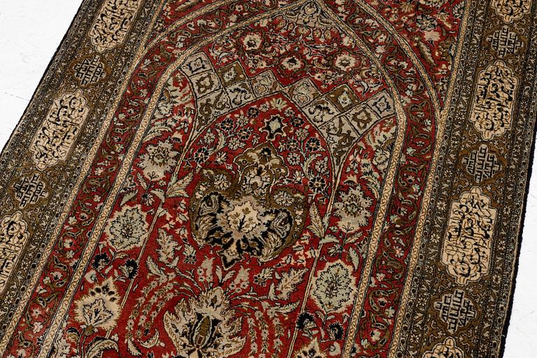 A silk Qum rug, c. 172 x 105 cm.