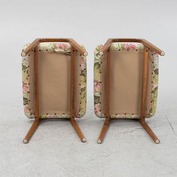 A pair of ottomans, 20th century.