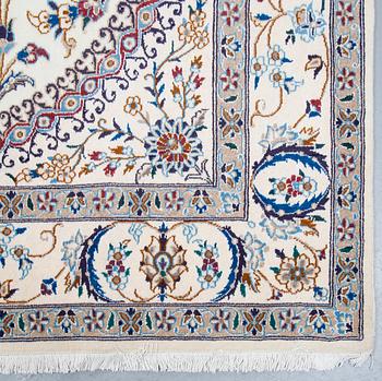 A carpet, Nain, part silk, ca 296 x 192 cm.