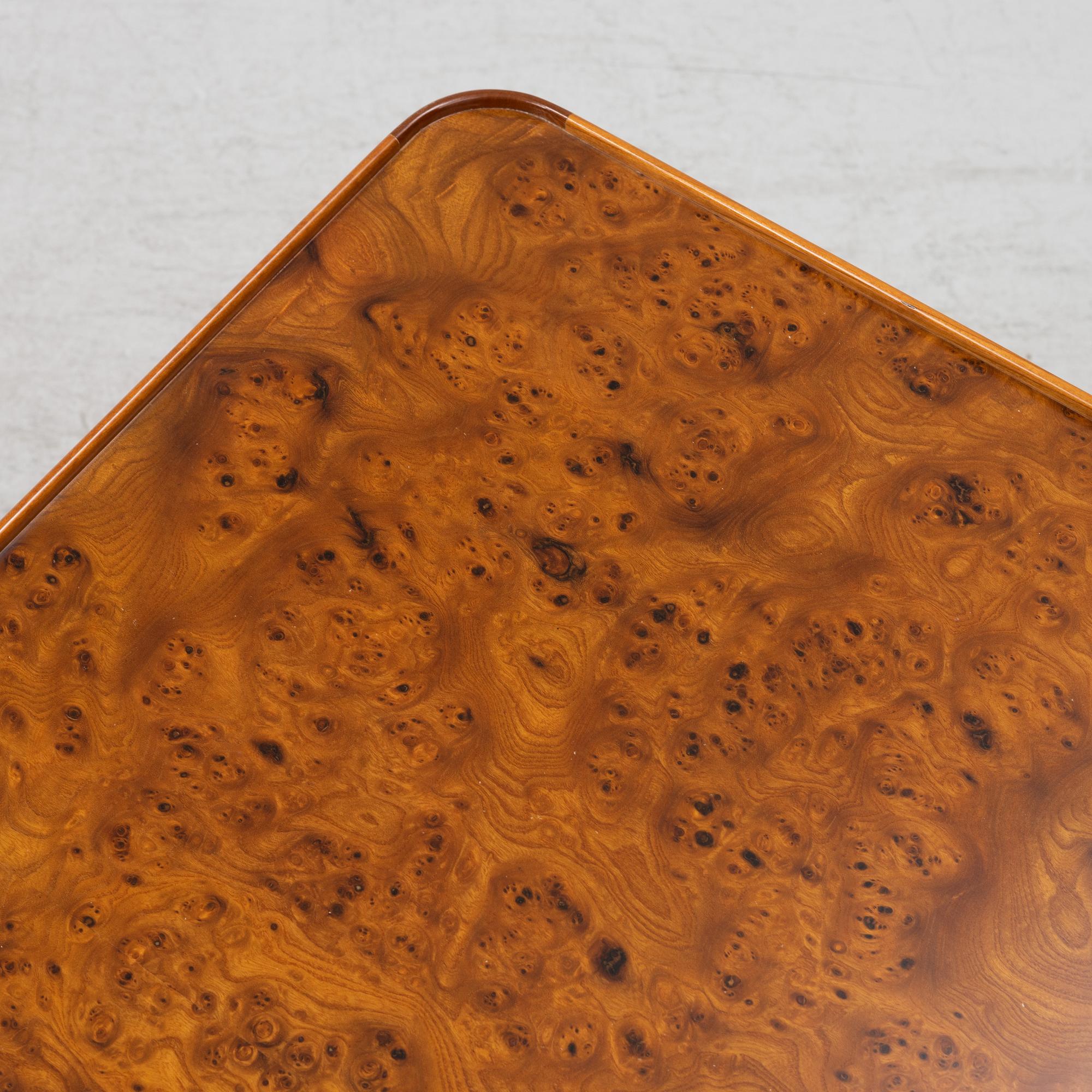 A Josef Frank mahogany and elm root model 2073 coffee table, designed 1949.