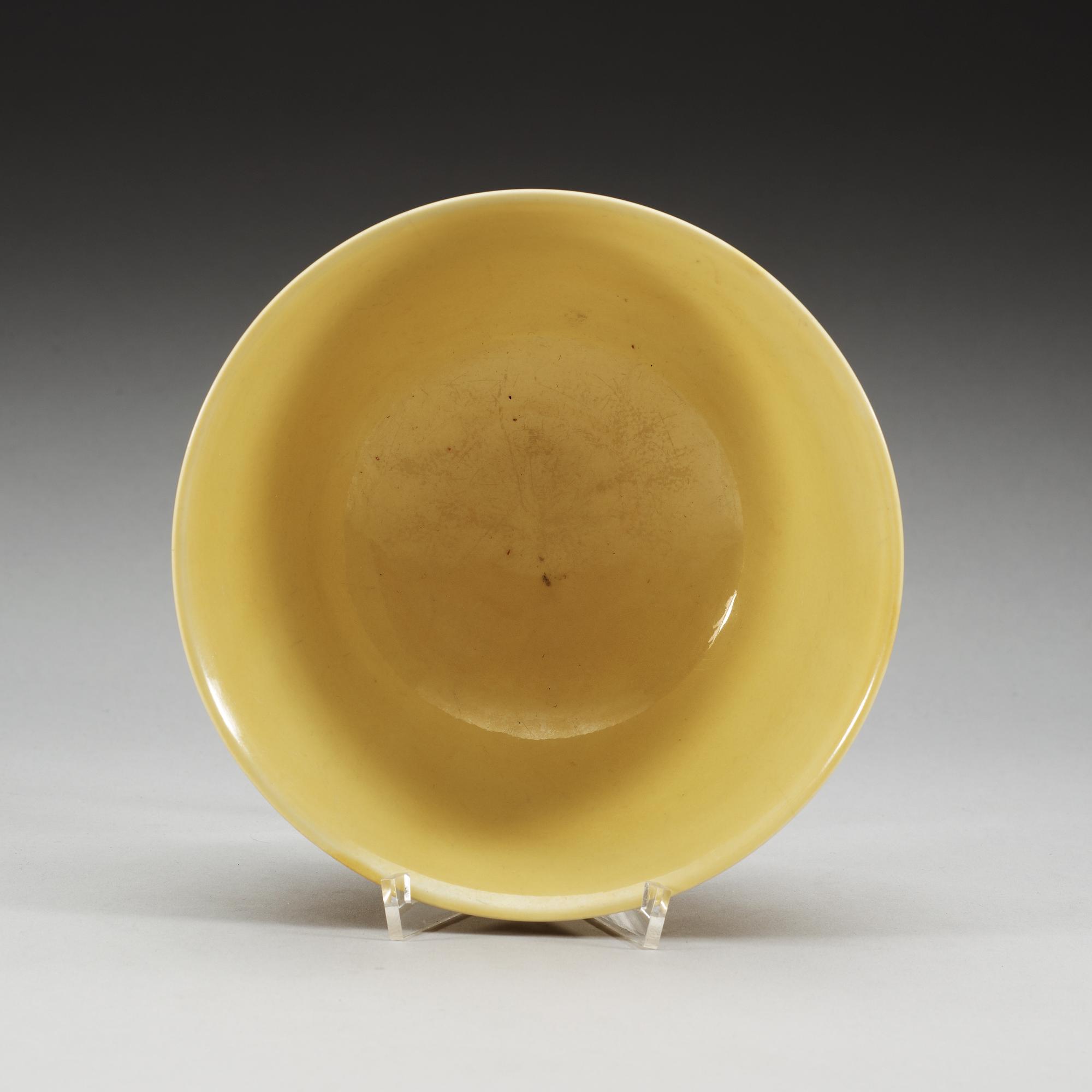 A yellow glazed bowl, Ming dynasty, with Jiajings six character mark and of the period (1522-66).