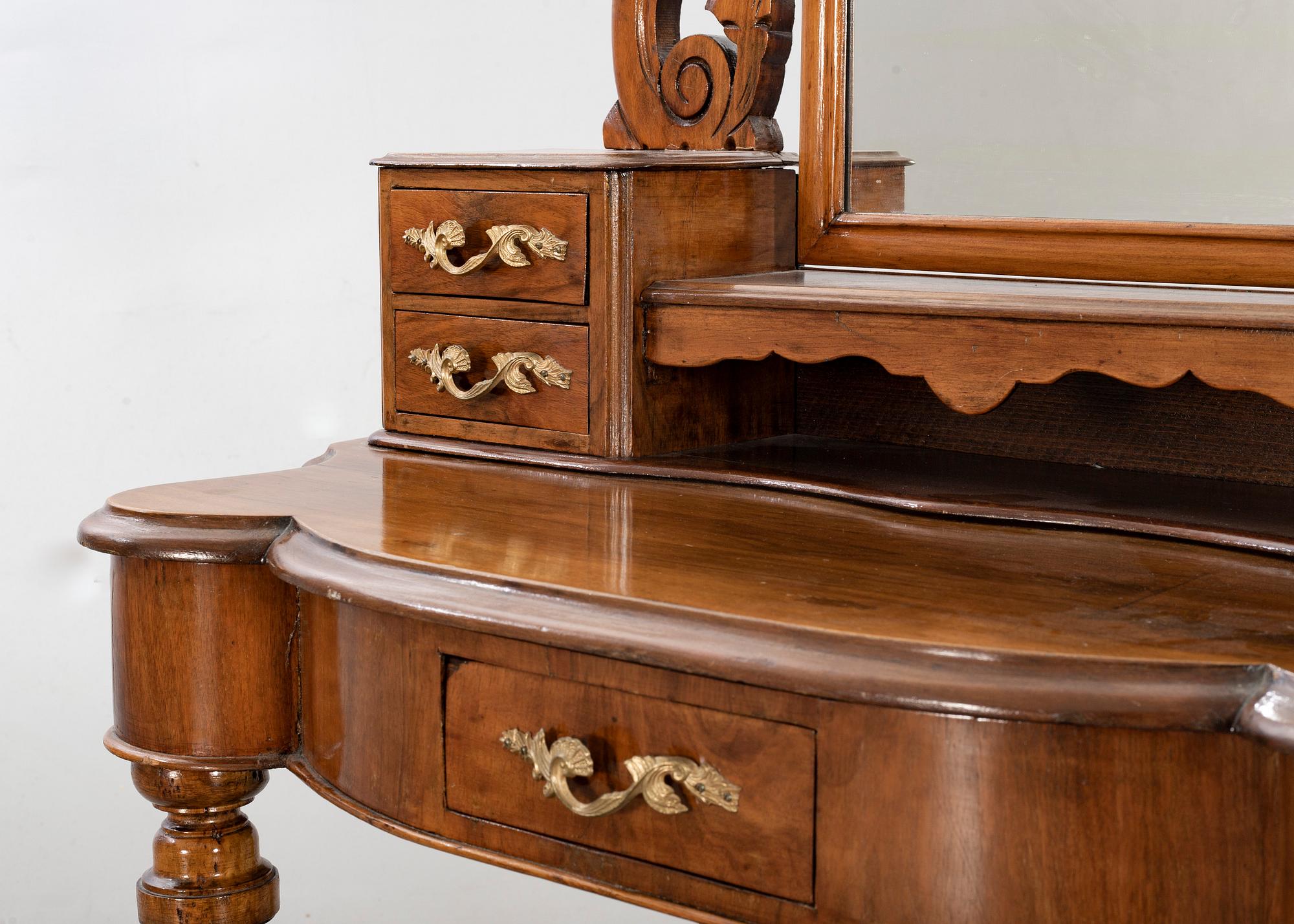 A second half of the 19th century table with mirror and a stool.
